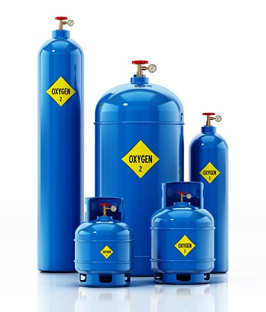 Various sized Oxygen tanks isolated on white.